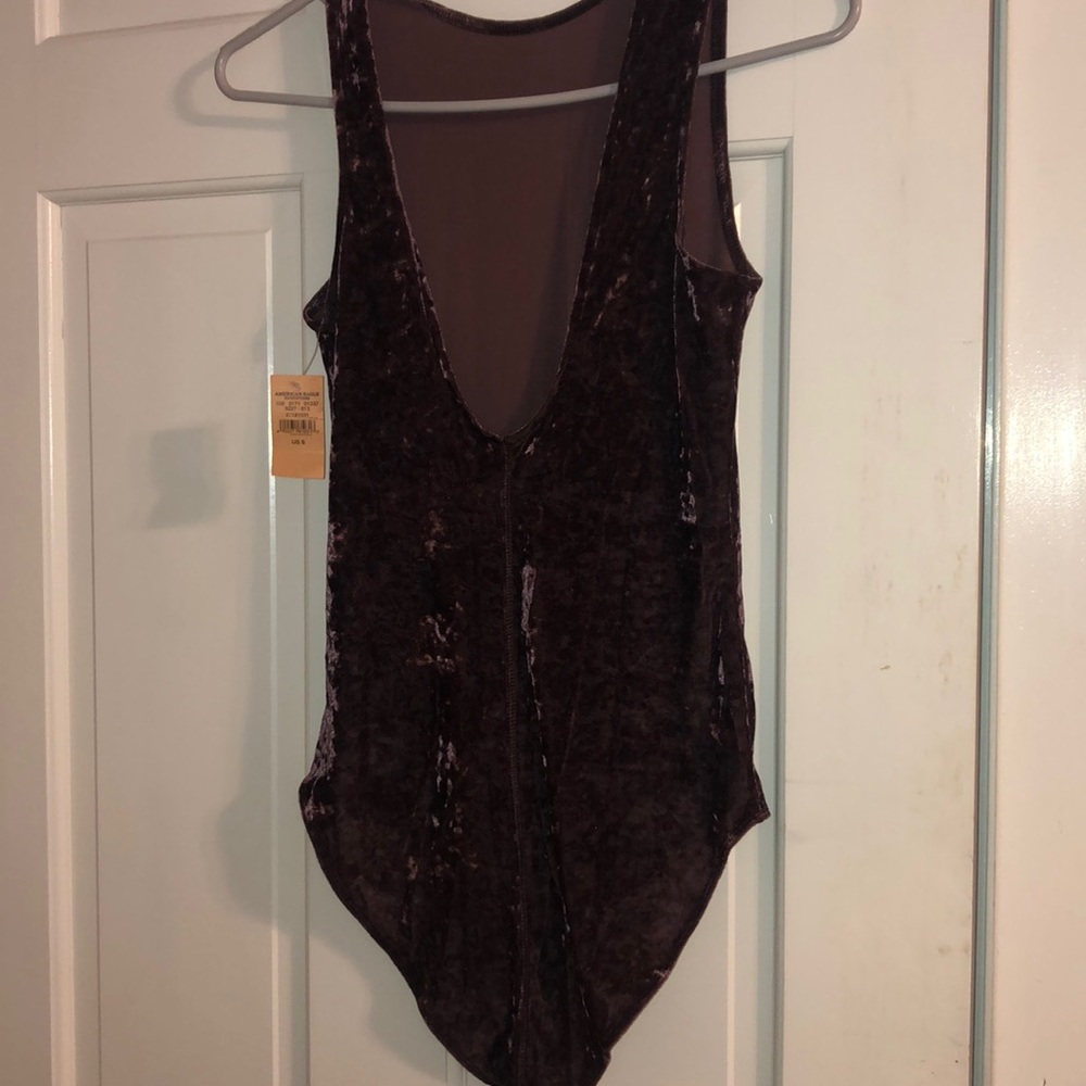 Light brown/purplish velvet body suit